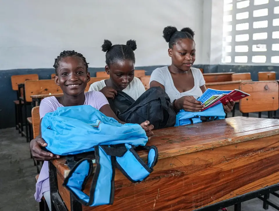 Students in Haiti with their school kits provided by UNICEF