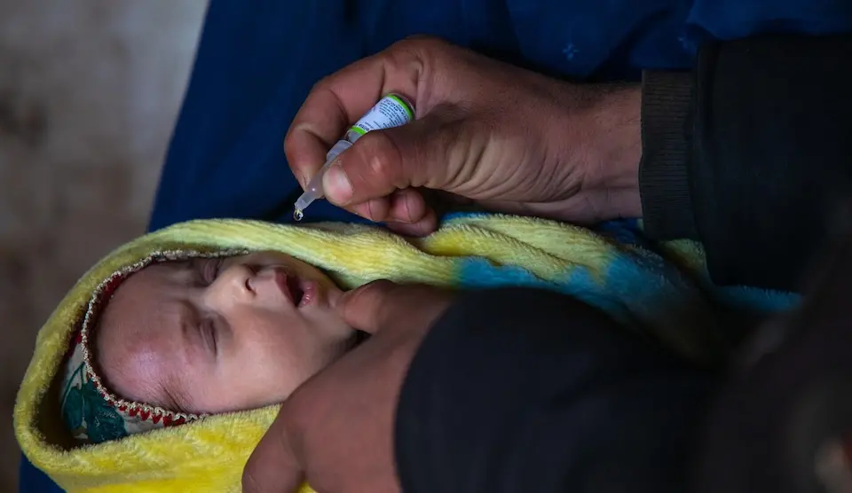 A baby is given a polio vaccine in Afghanistan
