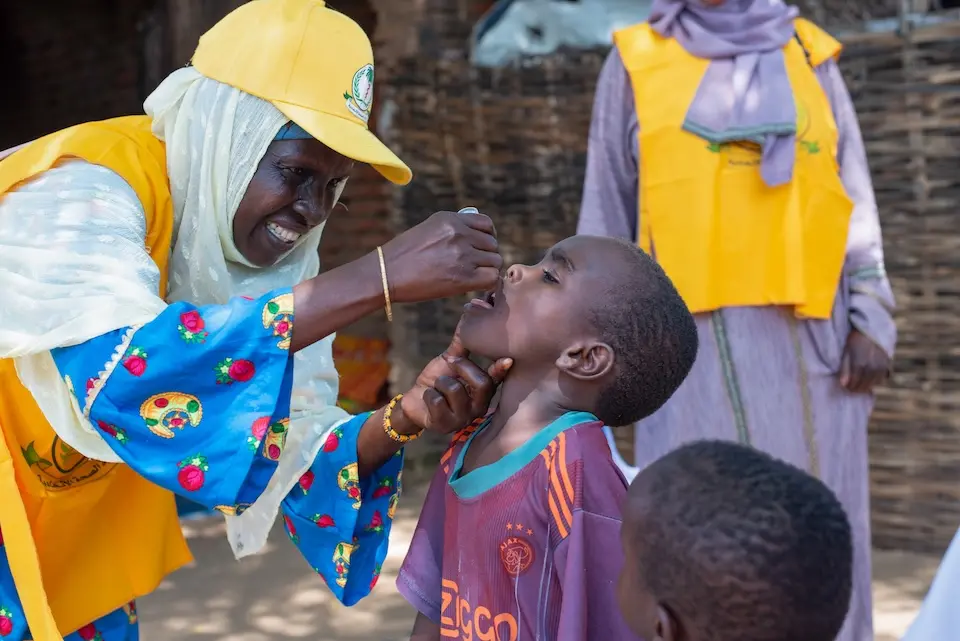 A child receives a polio vaccine during an outbreak response campaign in Central Darfur, Sudan.
