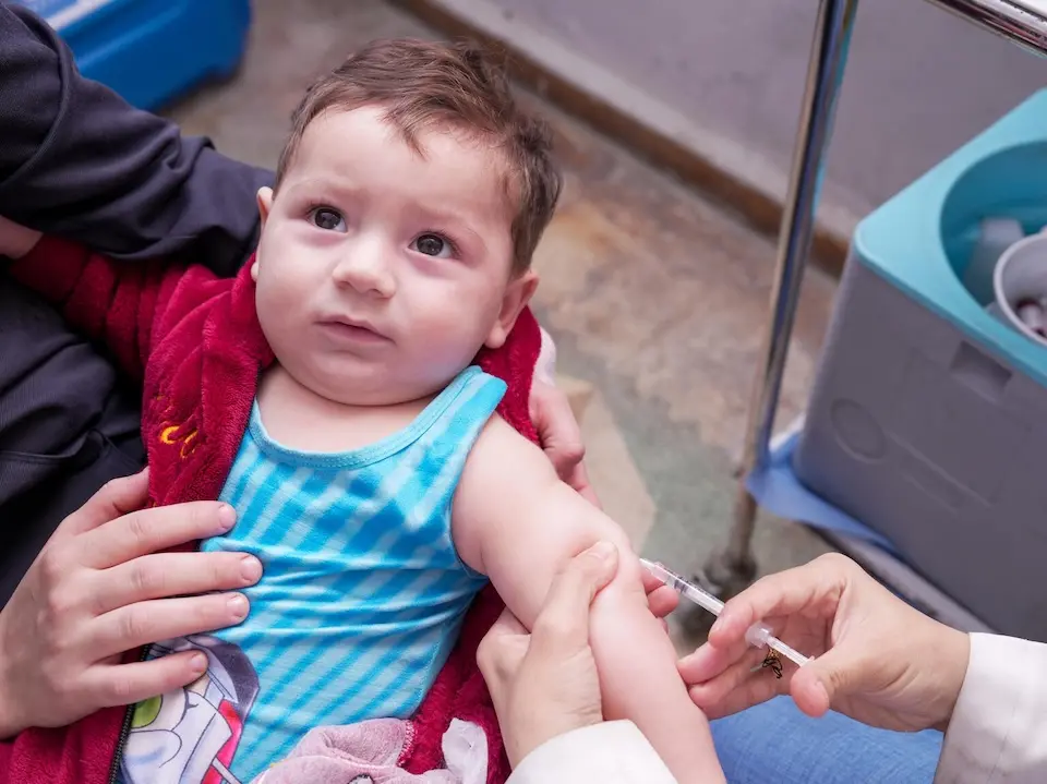 An 8-month-old boy received a measles vaccine in Syria as part of a UNICEF-supported vaccination campaign