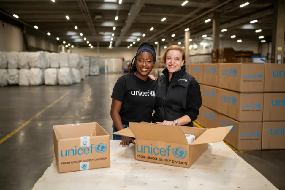 UNICEF Ambassador Amanda Gorman, left, with a UNICEF staff member at UNICEF's supply hub in Copenhagen.