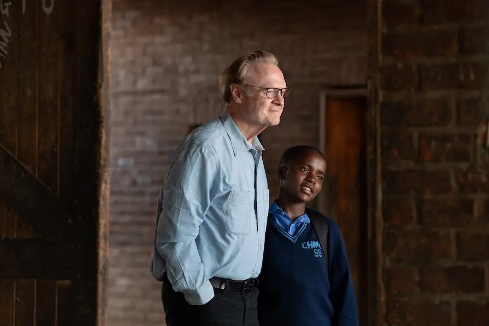 MS NOW's Lawrence O'Donnell with a student in Malawi. 