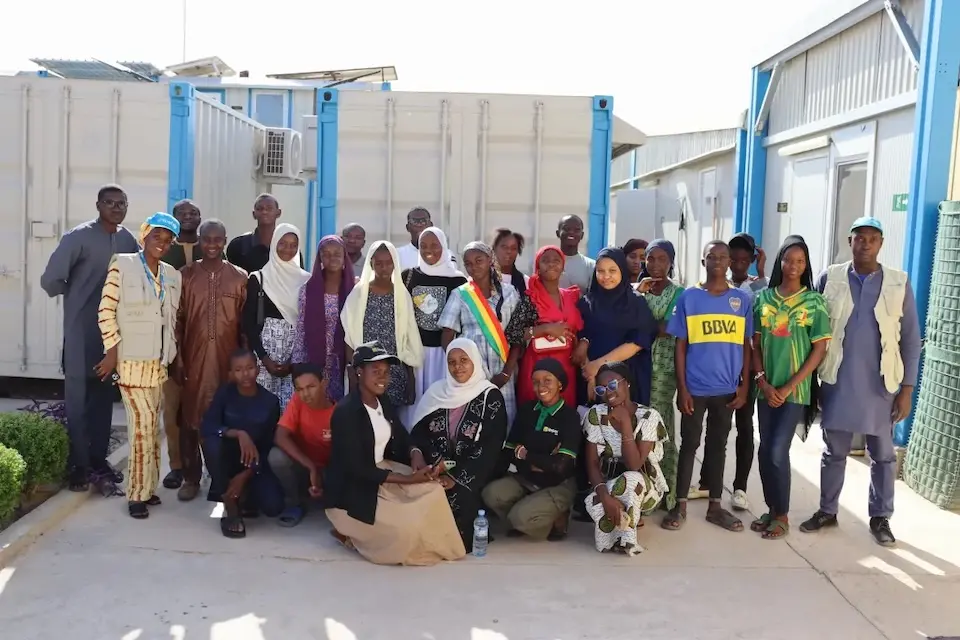 Young people in Timbuktu, Mali, pose for a group photo after a UNICEF disaster risk reduction training session.. 