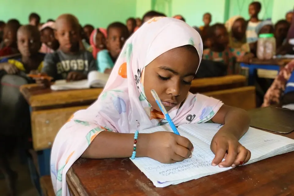 Animatou, 7, writes in her notebook at UNICEF-supported Kongo Gamo School in the Gao region of Mali.
