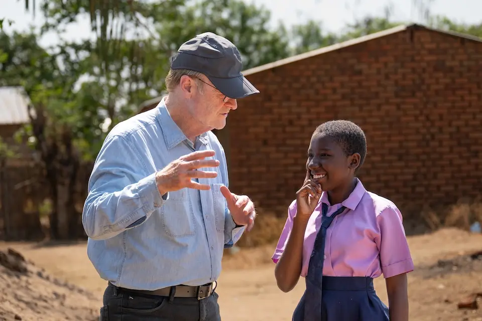 K.I.N.D. Fund Scholarship recipient Chikondi, 16, talks with MS NOW's Lawrence O'Donnell near her home in Salima district, Malawi.