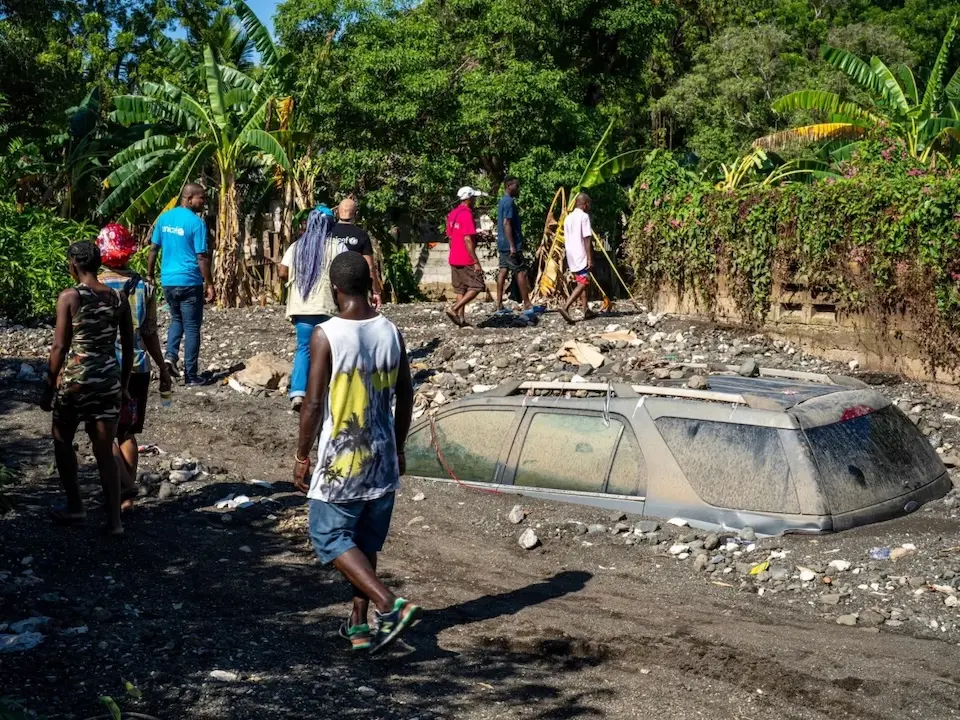UNICEF staff assess the damage caused by Hurricane Melissa in Petit-Goâve, where houses and vehicles lie buried under thick layers of mud.