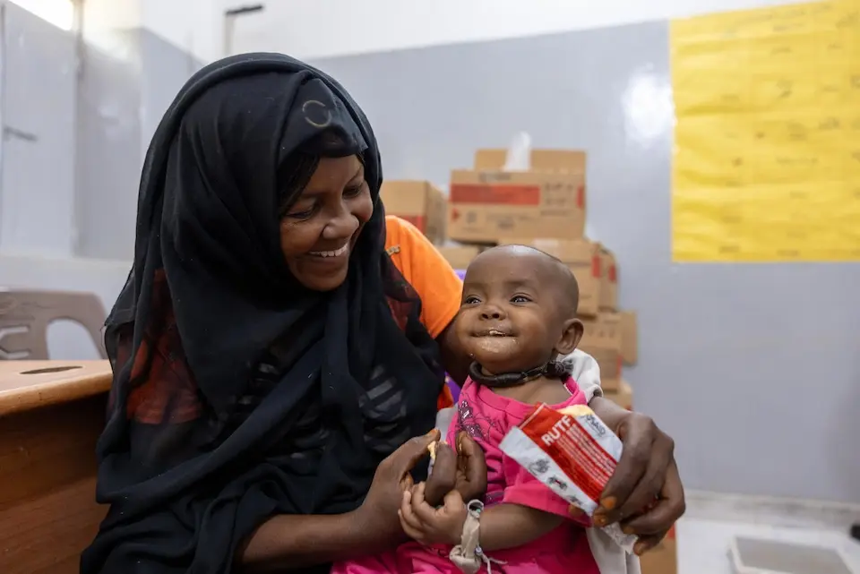 A mother feeds her baby ready-to-use therapeutic food at Al Jubarab primary health care facility in Atbara, River Nile State, Sudan on Oct. 27, 2025. 