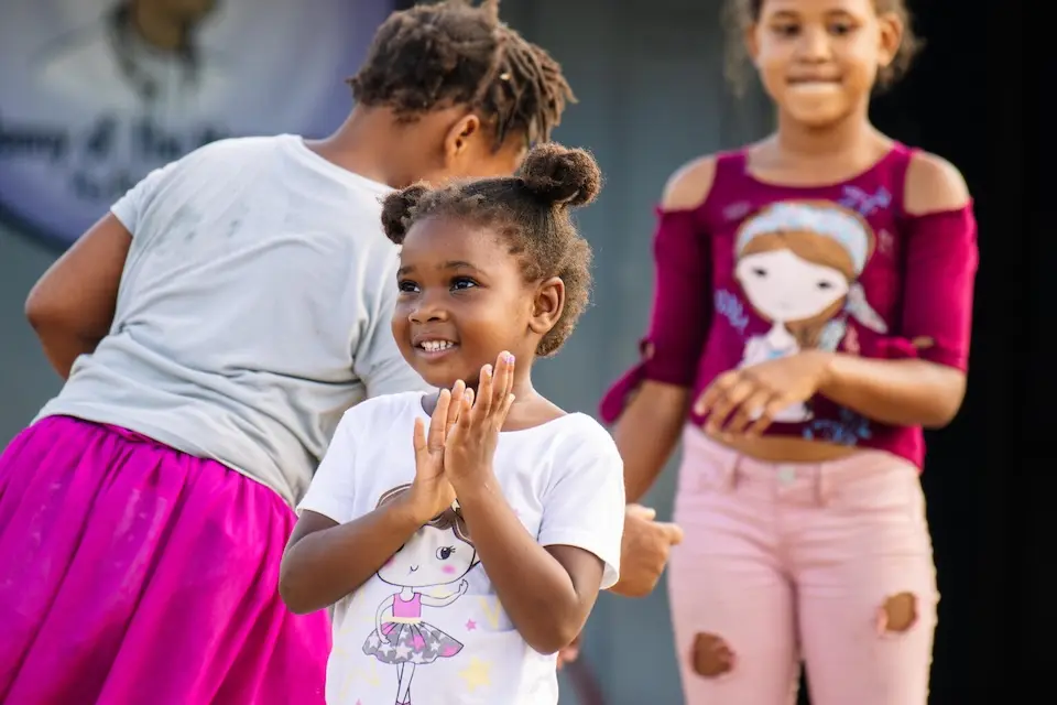 Children play outside their school in St. James, Jamaica, where hurricane recovery efforts continue.