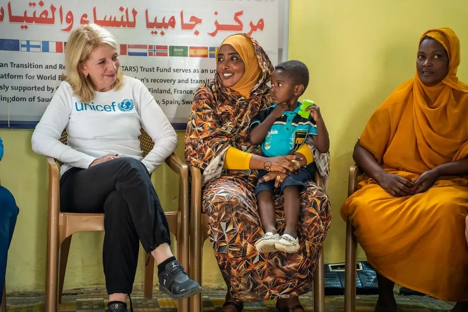 On Dec. 7, 2025, in Sudan, UNICEF Executive Director Catherine Russell interacts with women at a UNICEF-supported support center in Kassala State.