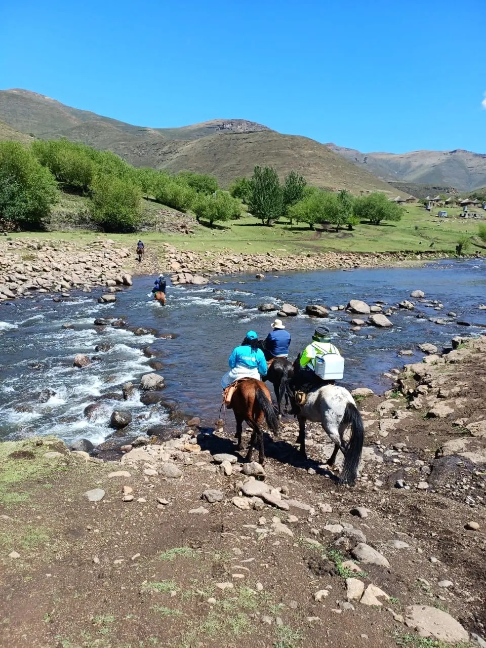 UNICEF-supported team travels on horseback to transport vaccines to hard-to-reach communities during a national vaccination campaign.