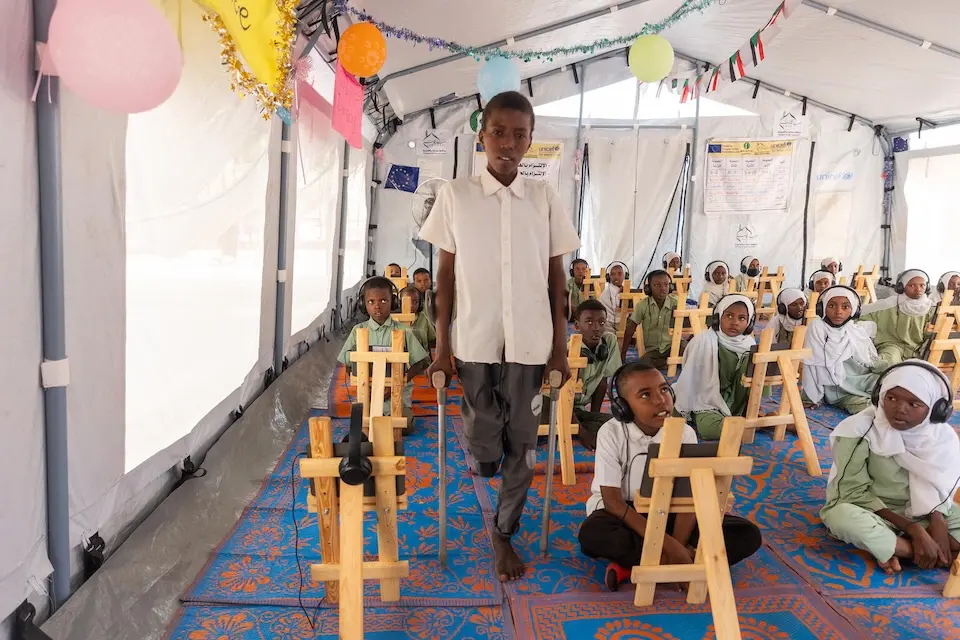 An 11-year-old injured by a bomb attends a digital learning session supported by UNICEF in Khartoum, Sudan.