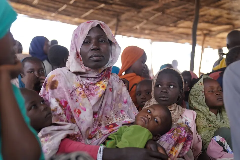 On Jan. 7, 2026, Hawa, a mother of four, brings her children for immunization during the UNICEF-supported measles and rubella catch-up campaign in Tawila, North Darfur, Sudan. 
