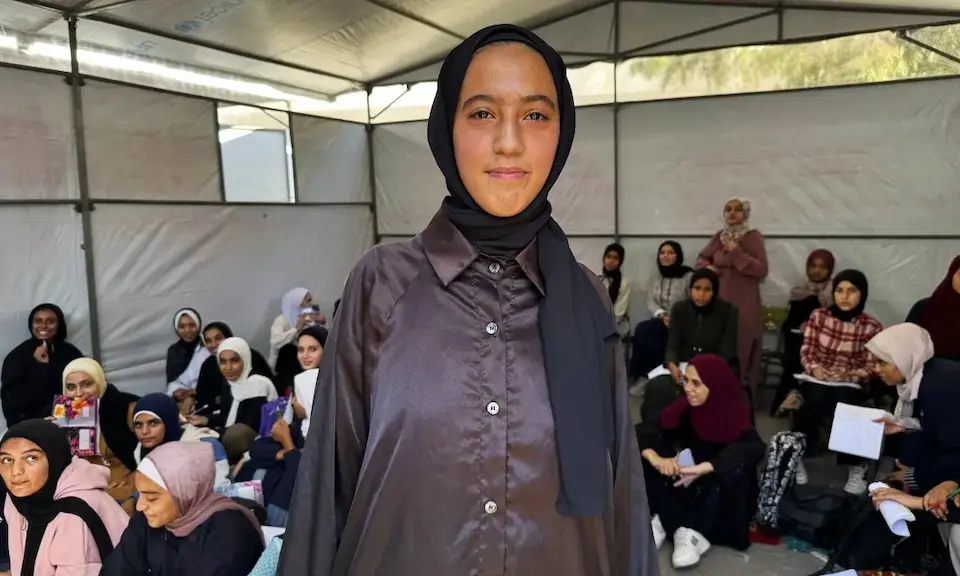Lama, 16, with her classmates in their temporary learning space created by UNICEF and partners in Deir al-Balah, Gaza..