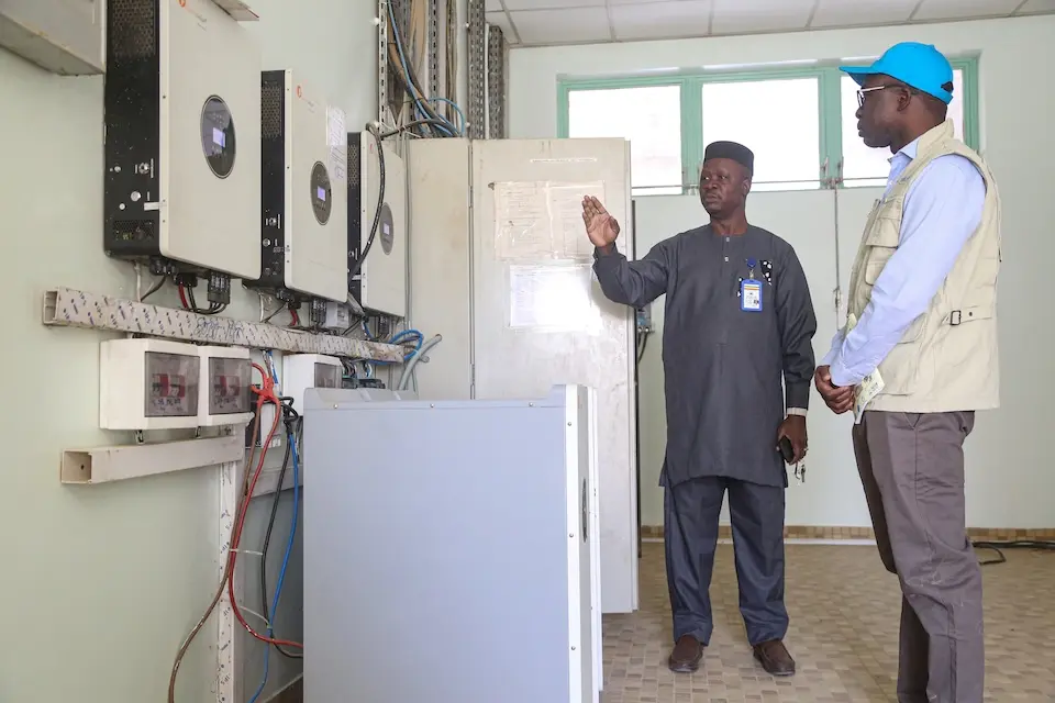 UNICEF and hospital personnel look at some of the equipment installed at the hospital in Timbuktu to enable it to run on solar power..