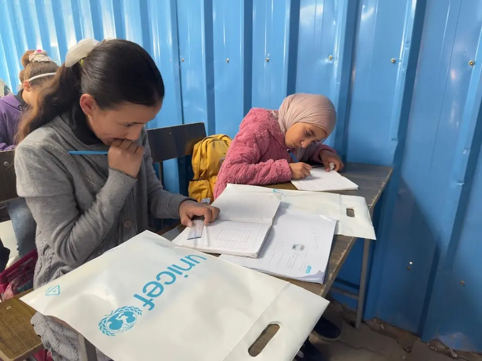On Jan. 31, 2026, students use school supplies delivered by UNICEF in Deir El Balah, Gaza. 