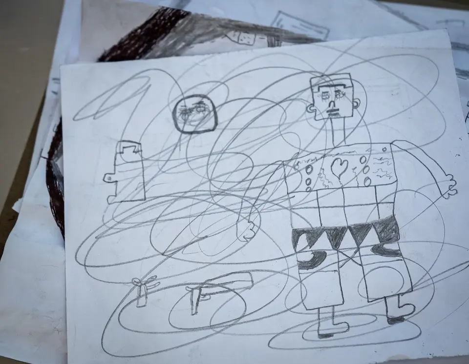 A pencil drawing by a child in Haiti who is in recovery after being recruited by an armed group.