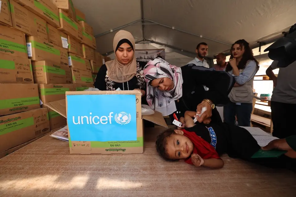 Nutrition supplies reach vulnerable children at a UNICEF-supported malnutrition screening and treatment point in Khan Yunis, southern Gaza Strip, in May 2025.