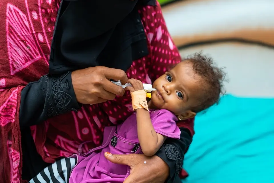 Nadia, 1, receives therapeutic milk at a UNICEF-supported treatment center in Hudaydah, western Yemen.