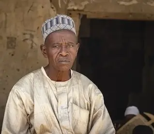 Religious teacher Goni Mai Hula outside his Tsangaya in Dala, Nigeria.