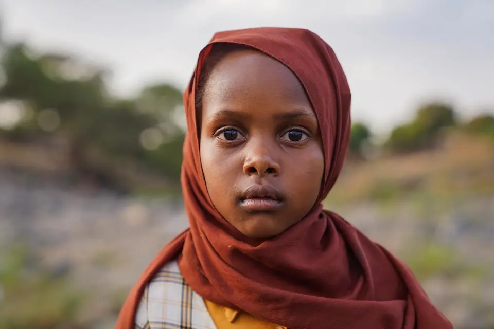 A 9-year-old girl arrives at a water yard in Golo Jadeeda camp, Central Darfur, Sudan.. 