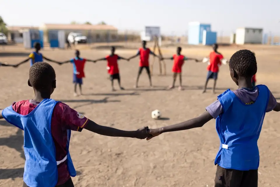 Children prepare for a soccer game at a UNICEF-supported child-friendly space in Sudan. 