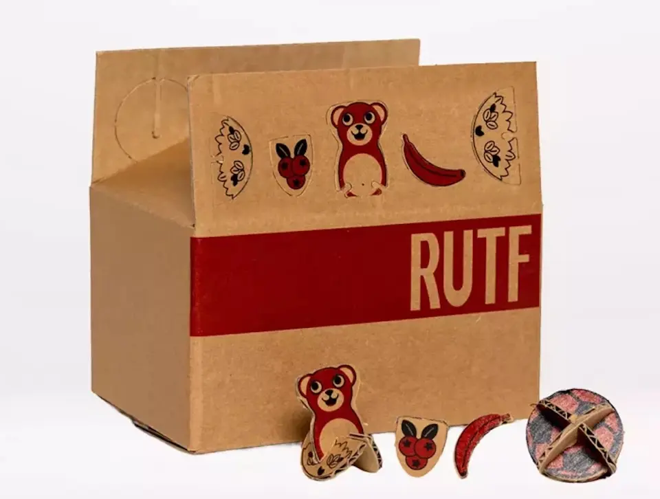 UNICEF RUTF cardboard packaging includes cut-out toy designs.