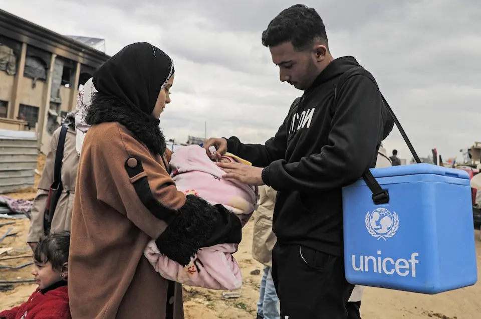 A UNICEF-supported vaccinator administers the polio vaccine to a baby in Jabalia, northern Gaza on Feb. 23, 2025. After the…