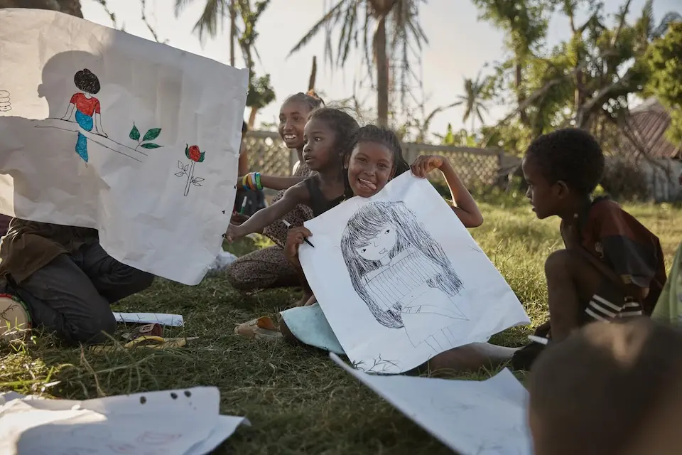 In Madagascar, at a child-friendly space for children affected by Tropical Cyclone Gezani, a 13-year-old girl shows her drawing.