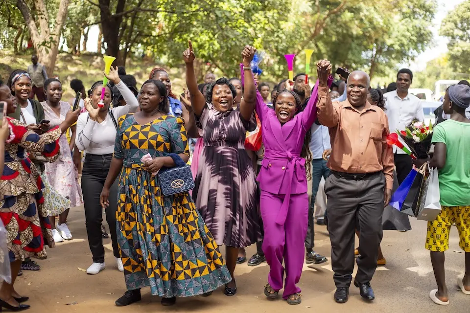 A student and her family celebrate her university graduation in Malawi in April 2026.
