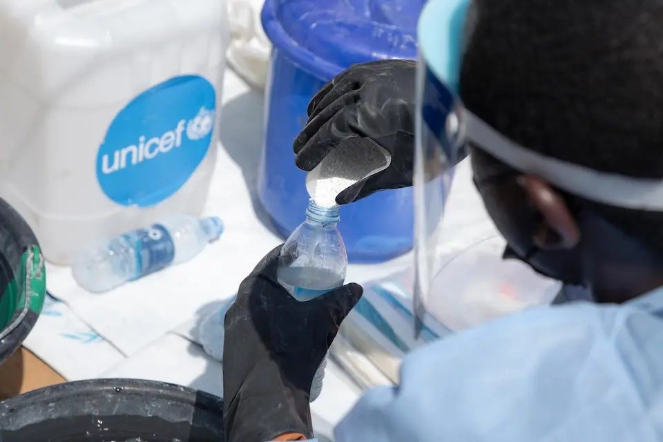 UNICEF-supported decontamination team at work in an Ebola-infected home in Bunia, Ituri, DR Congo.