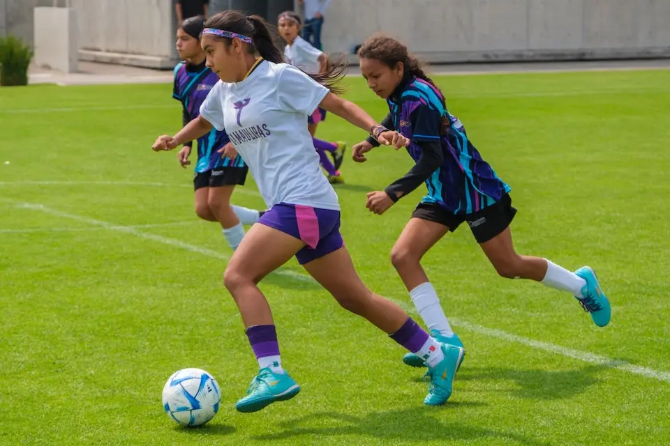 Girls play in the National School Soccer Tournament in Toluca, Mexico in 2025. 