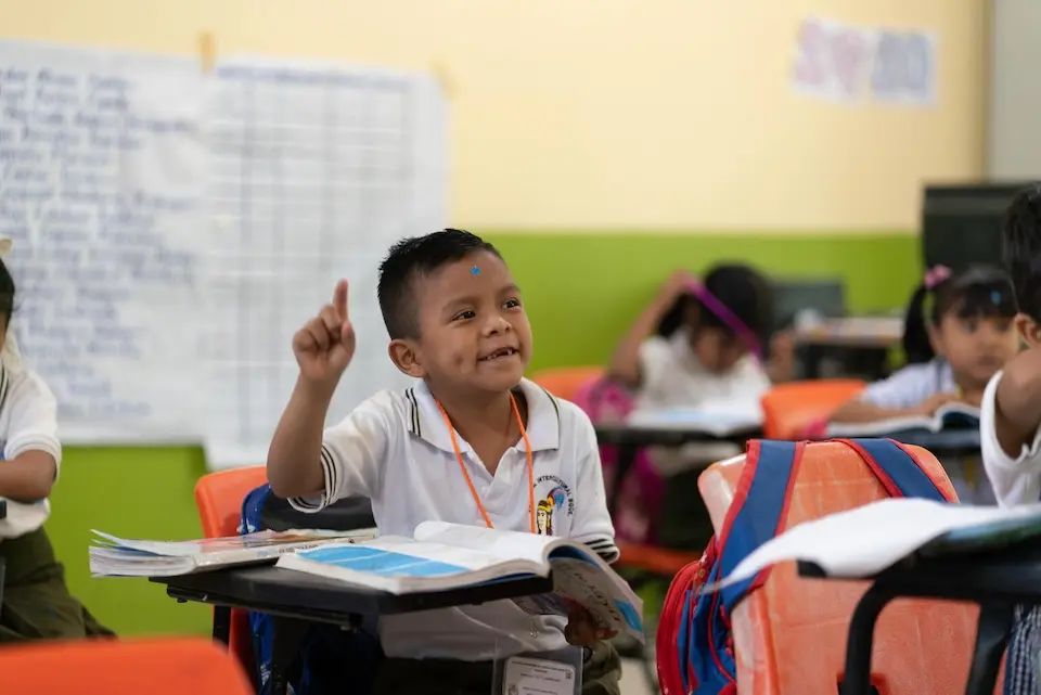 A student raises his hand in class at Izcóatl Primary School in Ayutla de los Libres, Guerrero, Mexico.