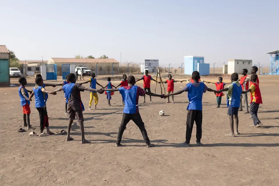 children prepare for a football game at the UNICEF-supported child-friendly space in Al Kashafa camp, White Nile State in 2026.