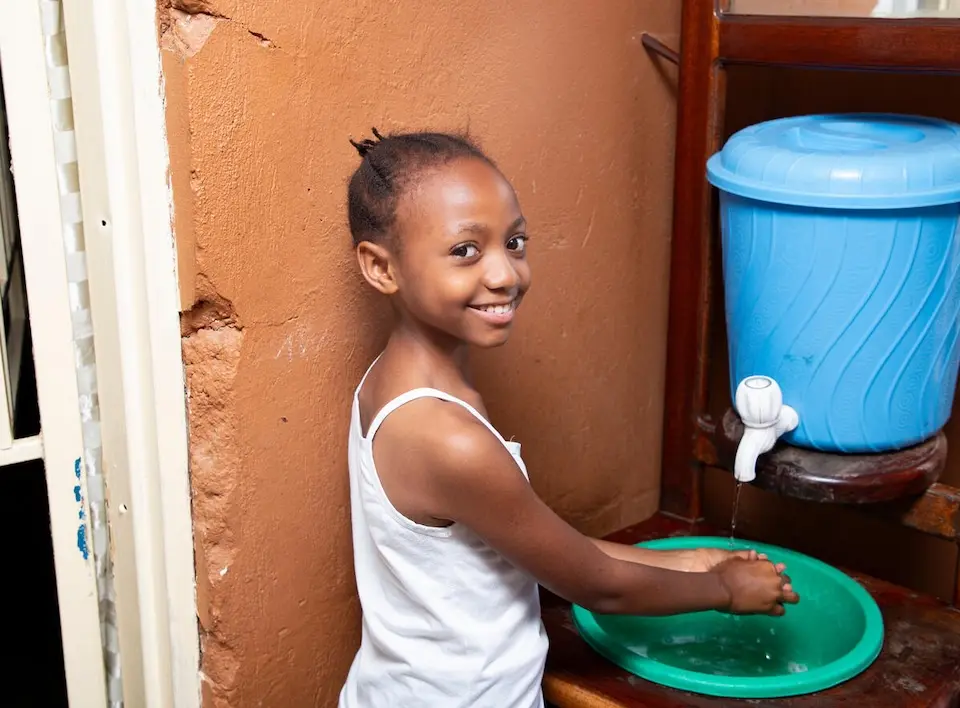 A girl washes her hands at home in Ituri province, epicenter of May 2026 Ebola outbreak in DR Congo.