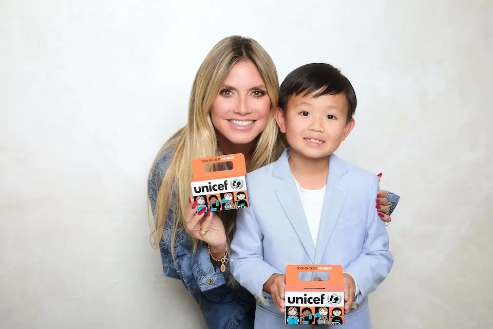 UNICEF Heidi Klum and Harrison hold Trick-or-Treat for UNICEF boxes. 
