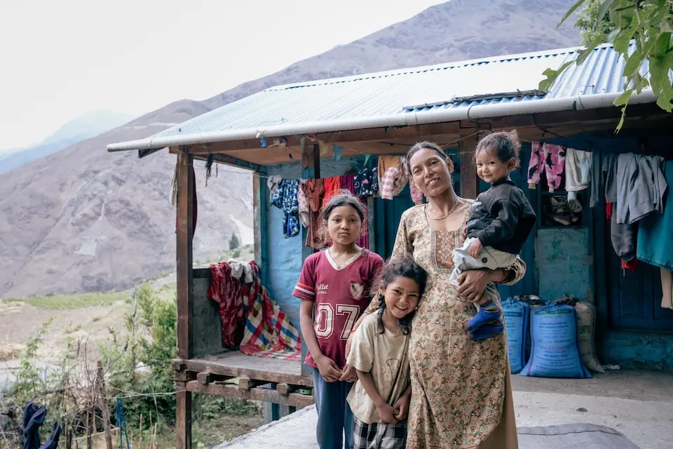 A mother and children outside their home in Dolpa District, Nepal. 