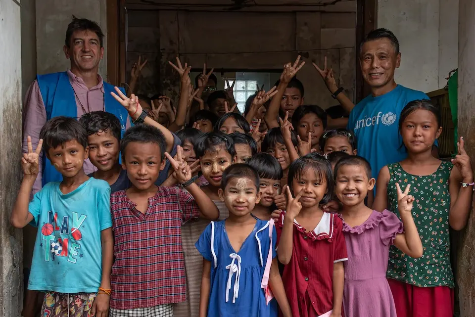 Yasumasa Kimura, UNICEF Representative to Myanmar, and Barnaby Jones, UNHCR Representative, meet children at a Child-Friendly Space in Sittwe, Rakhine State, Myanmar, during a joint mission to displacement sites. 
