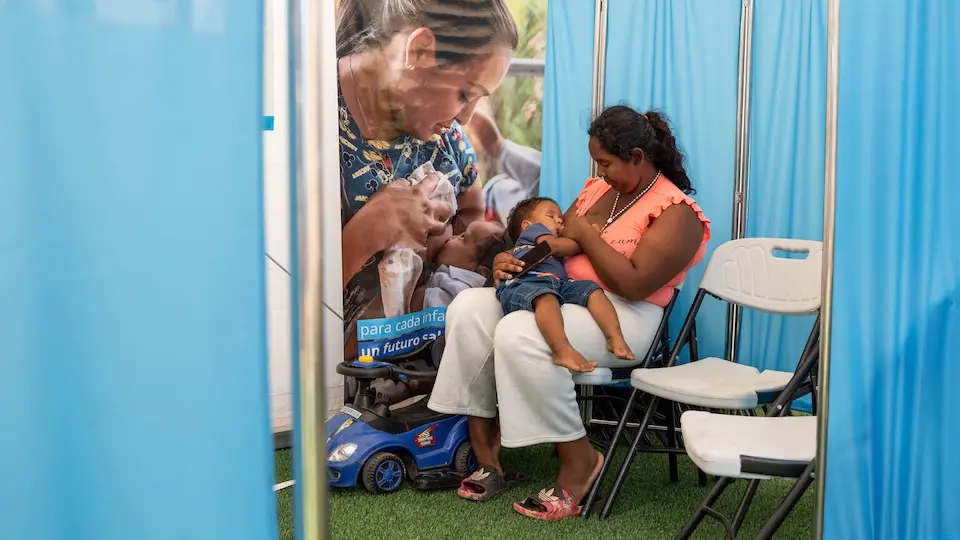 A mother breastfeeds at a UNICEF-supported space for families impacted by the 2026 Venezuela earthquakes.