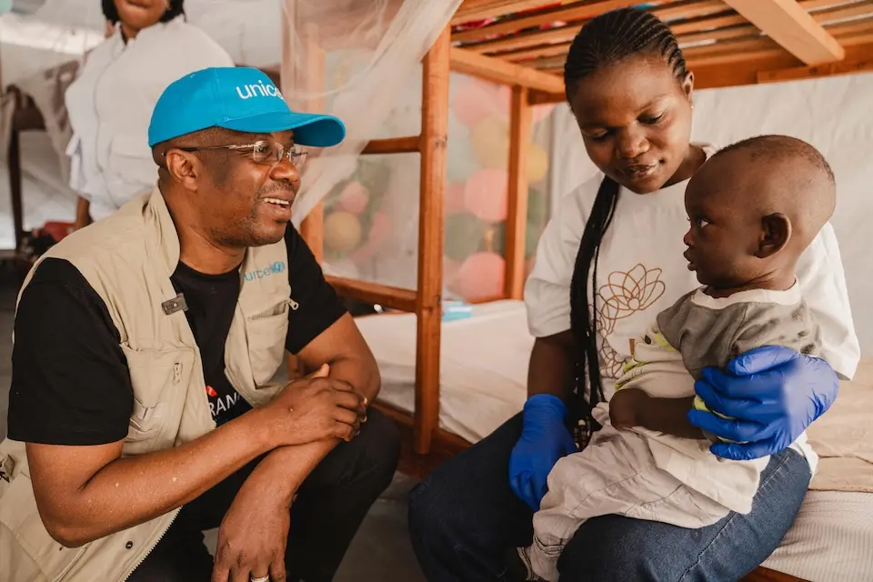  &nbsp; Gilles Fagninou, UNICEF Regional Director for West and Central Africa, with a child and caregiver at a nursery in Bunia, Ituri province, DR Congo.