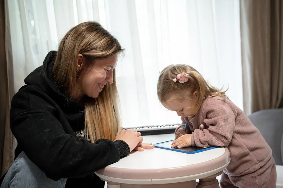 Two-year-old Eva and her mother, Daryna, at home in Kharkiv City, Ukraine. 