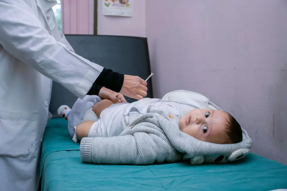 A child is vaccinated in Damascus, Syria.