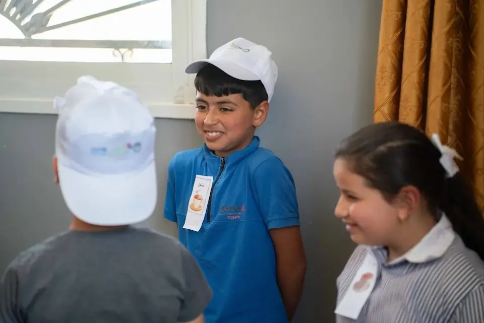 Muhannad, 8, and friends in a UNICEF-supported learning space in the West Bank.