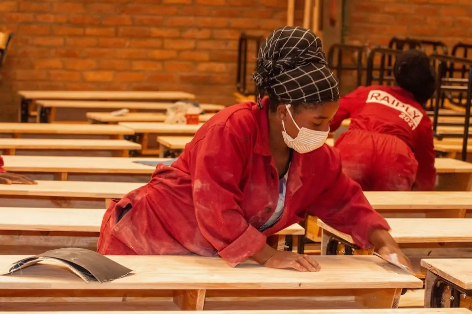 Workers at a factory in Mzimba assembling desks courtesy of the K.I.N.D. Fund. 