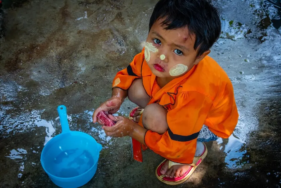 Twal Tar Lin, 4, washes her hands with soap at her home in Myanmar.
