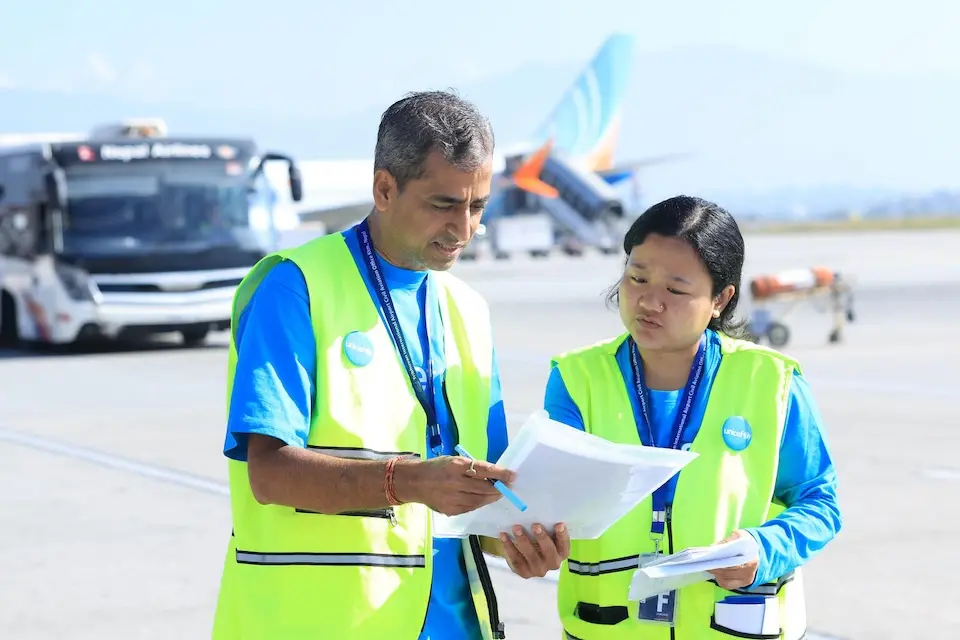 UNICEF staff check and record the delivery of measles-rubella vaccine in Nepal on Oct. 14, 2026. 