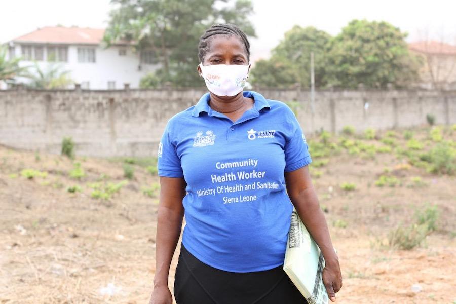 Adama Kamara, a Community Health Worker in Hastings, western Sierra Leone, heads out to do home visits.