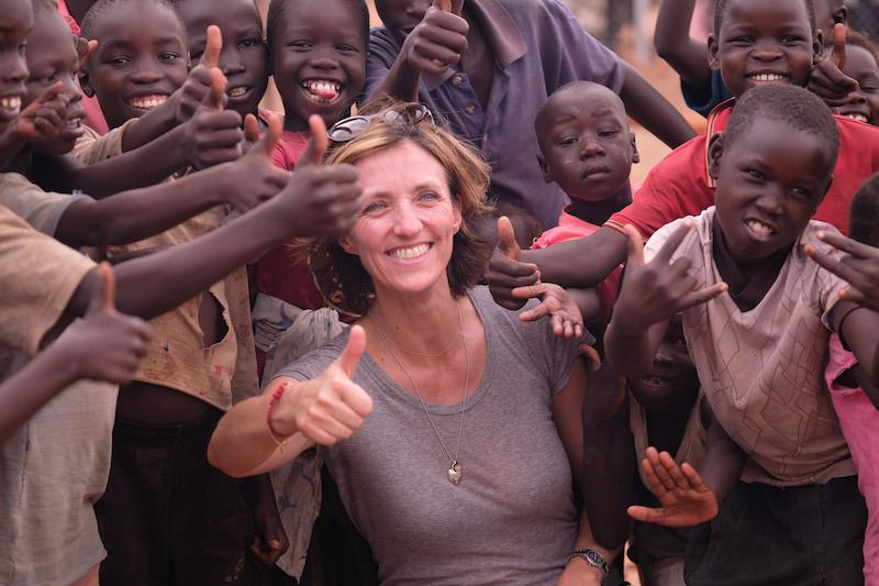 Justin in Uganda LDS with children