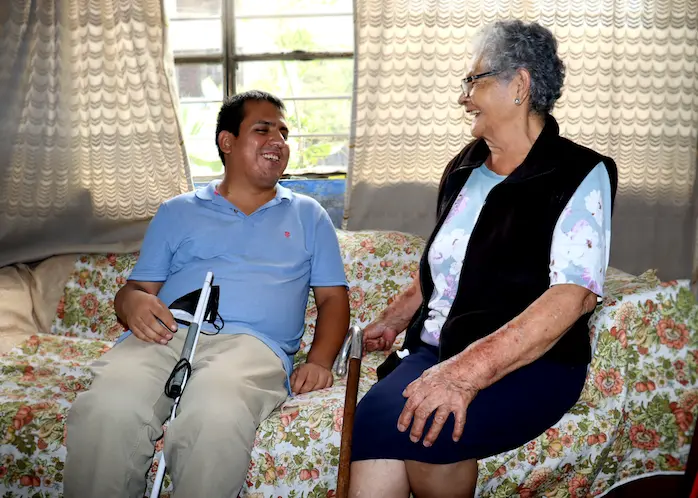 Espinoza entertains his grandmother with stories about how much his students enjoy his innovative “creative reading” workshops in Peru.. 
