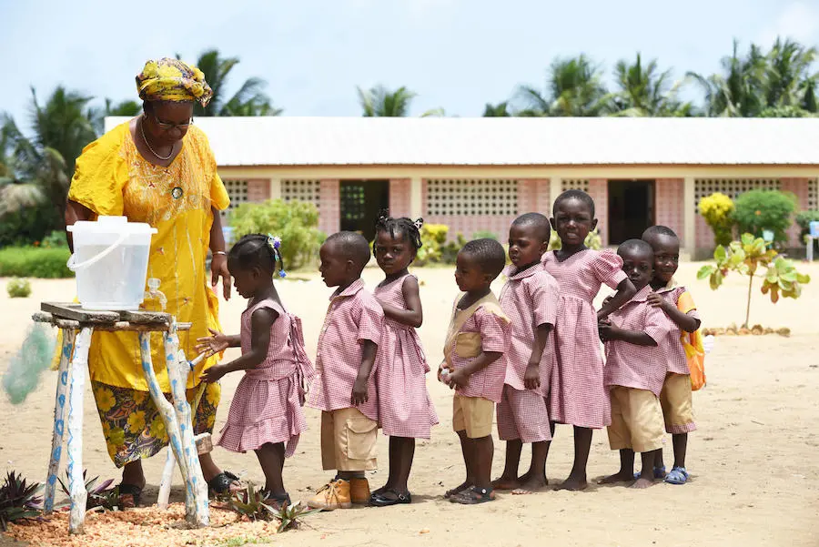 Young children washing their hands at school in Essankro, Côte d'Ivoire. Unicef, handwashing, Côte d'Ivoire