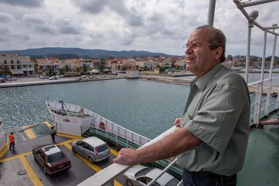 Man Leaning on Railing on Ferry